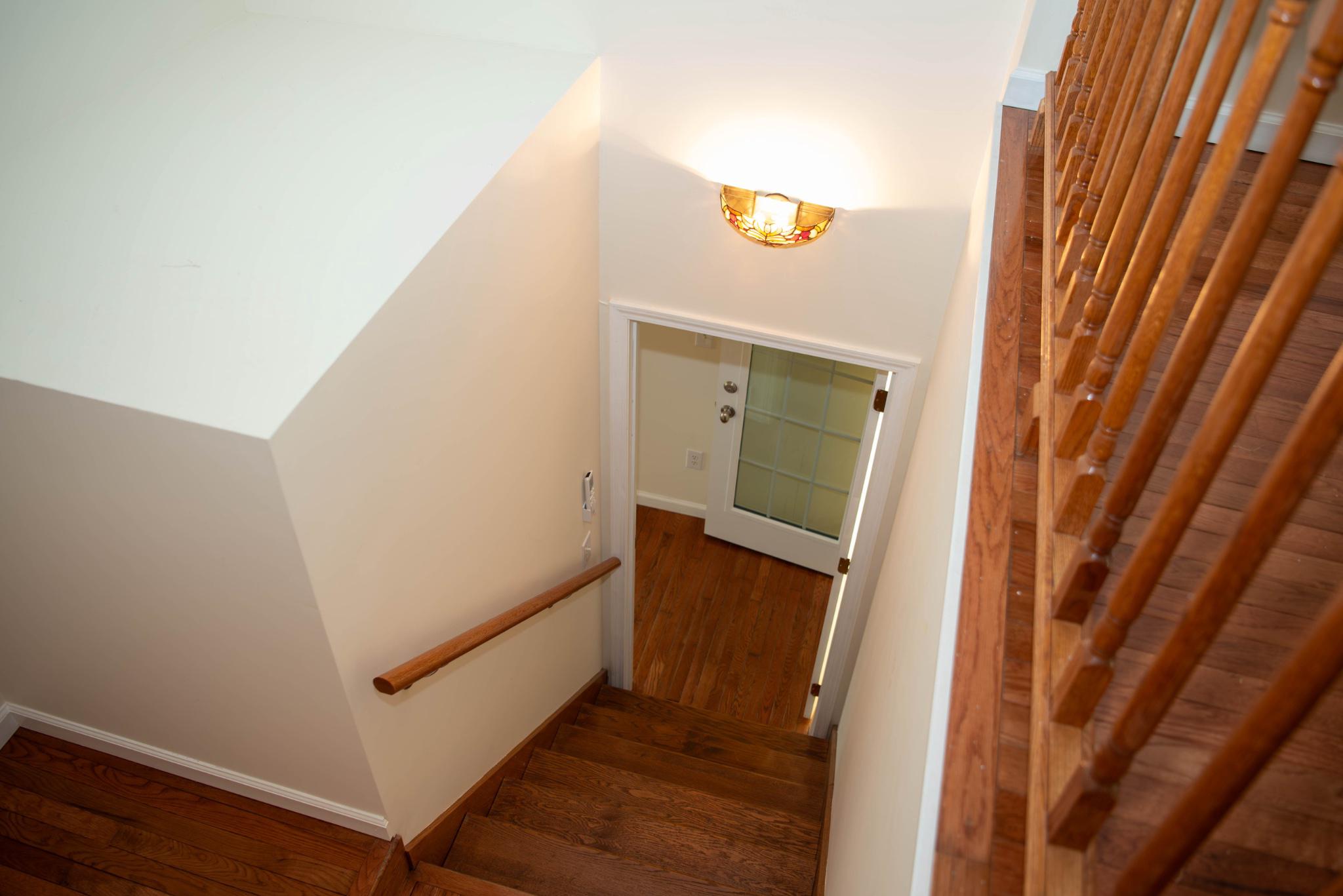 792 Forest Glen Road Moorefield, WV 26836 - Photo 102 of 146 Inviting staircase from upper level to bonus room.