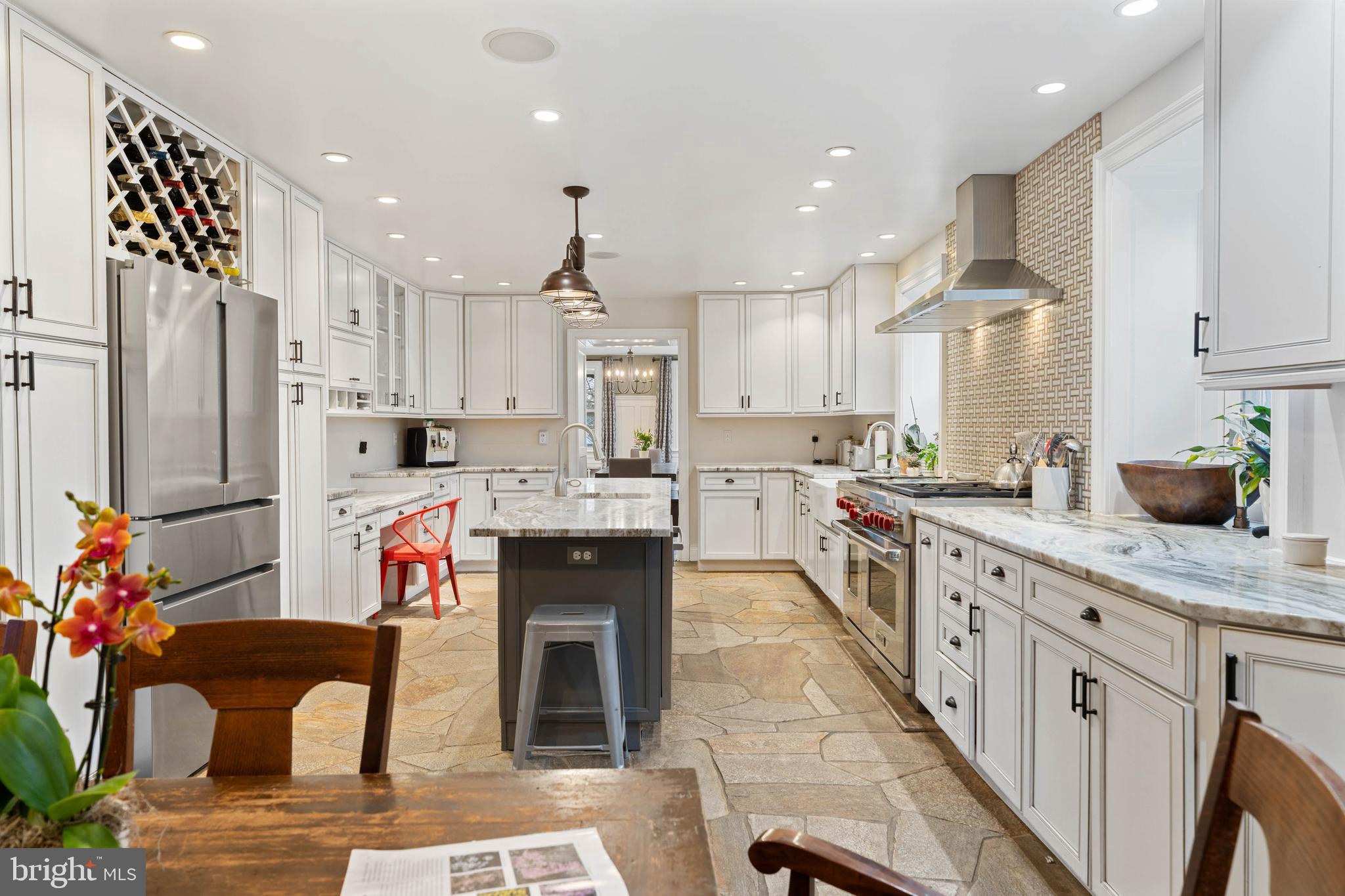 15314 Priceville Road Sparks Glencoe, MD 21152 - Photo 21 of 33 a kitchen with stainless steel appliances kitchen island granite countertop a refrigerator a sink and a stove