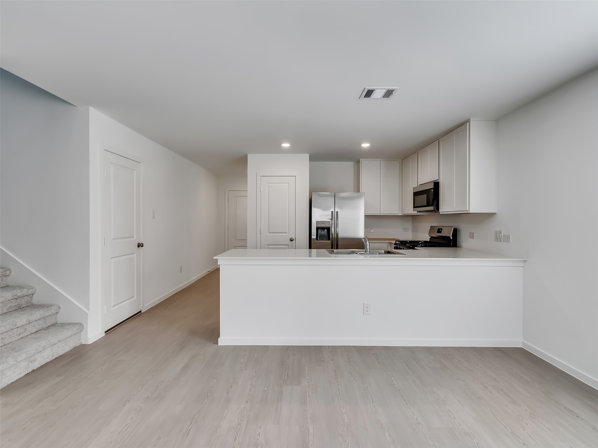 3041 Colusa Rdg Drive Katy, TX 77493 - Photo 5 of 26 a view of kitchen with stainless steel appliances refrigerator sink and microwave