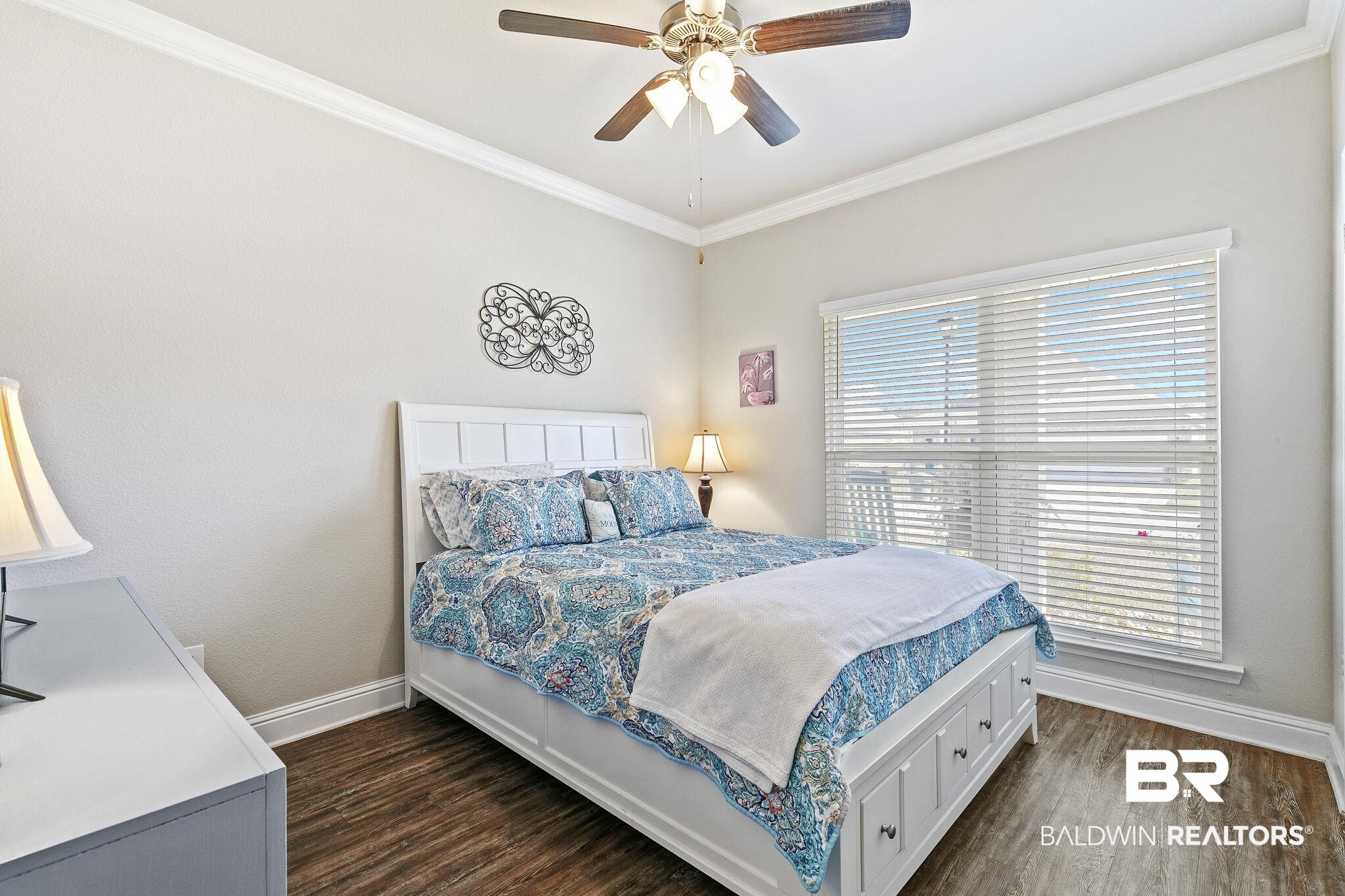 1319 Kairos Loop Foley, AL 36535 - Photo 36 of 64 Bedroom with ceiling fan, ornamental molding, dark wood-type flooring, and multiple windows