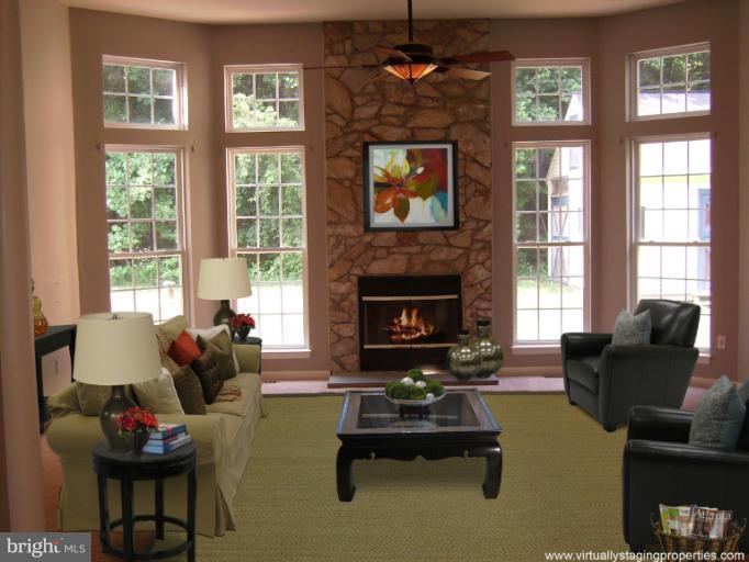 9319 Old Court Road Baltimore, MD 21244 - Photo 2 of 23 a living room with furniture fireplace and window