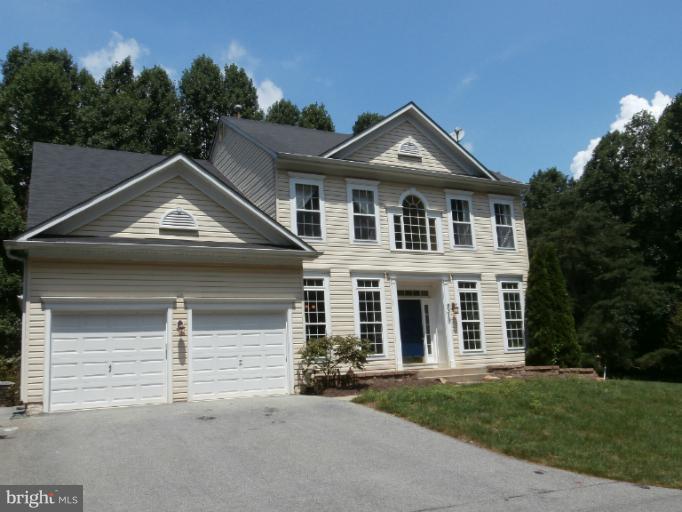 9319 Old Court Road Baltimore, MD 21244 - Photo 13 of 23 front view of a house with a yard