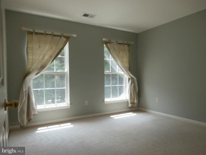 9319 Old Court Road Baltimore, MD 21244 - Photo 14 of 23 an empty room with windows