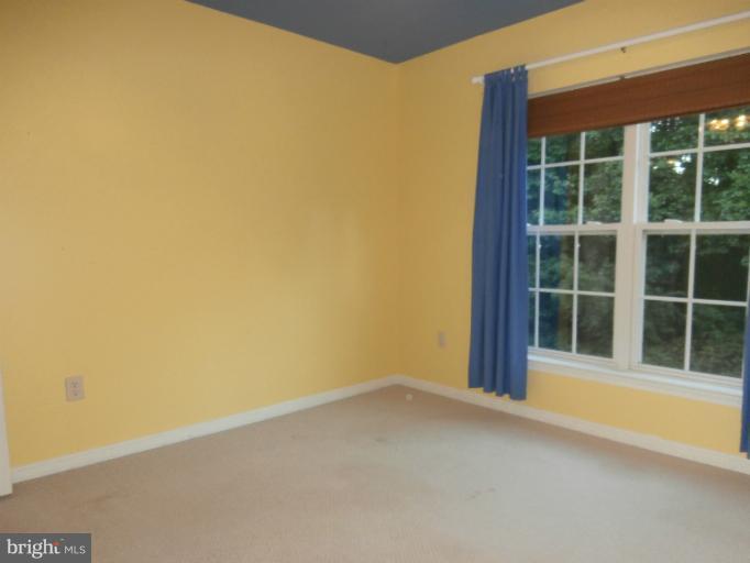 9319 Old Court Road Baltimore, MD 21244 - Photo 19 of 23 a view of an empty room with a window