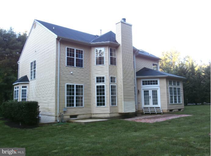 9319 Old Court Road Baltimore, MD 21244 - Photo 20 of 23 a front view of a house with a garden and yard