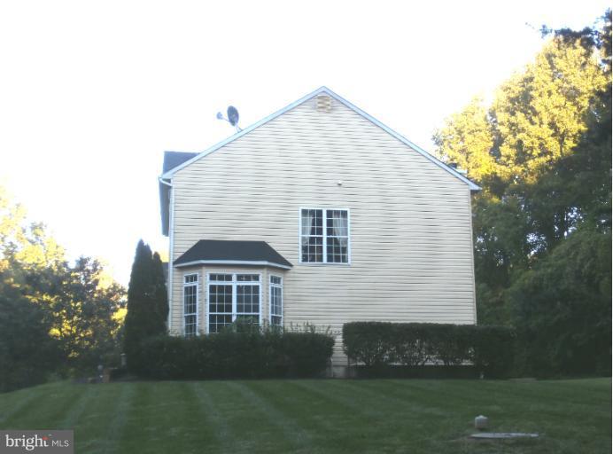 9319 Old Court Road Baltimore, MD 21244 - Photo 21 of 23 a front view of a house with a yard