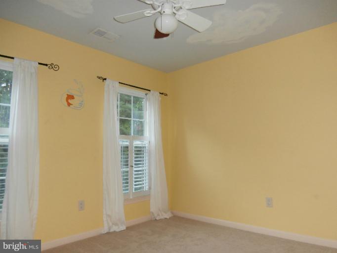 9319 Old Court Road Baltimore, MD 21244 - Photo 22 of 23 a view of a livingroom with a chandelier fan