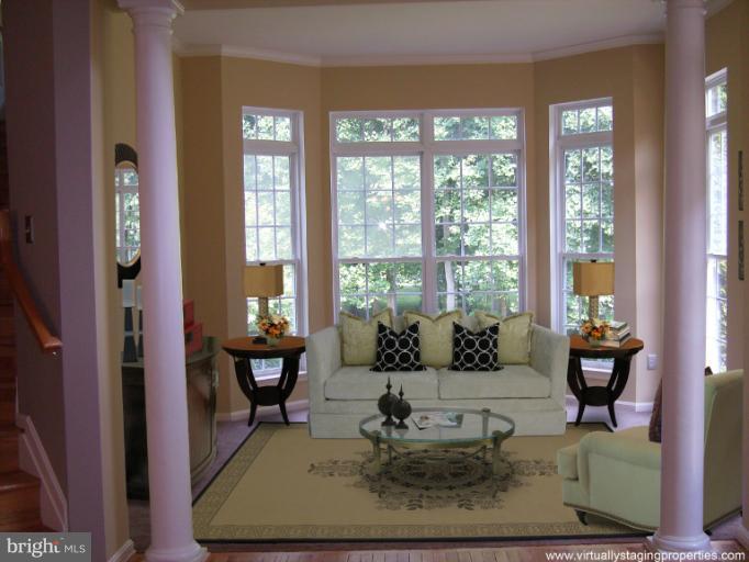 9319 Old Court Road Baltimore, MD 21244 - Photo 5 of 23 a living room with fireplace furniture and large windows
