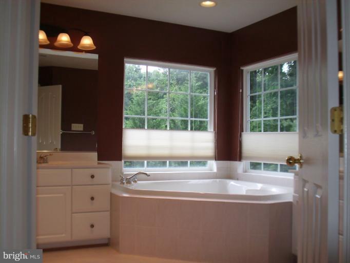 9319 Old Court Road Baltimore, MD 21244 - Photo 7 of 23 a view of a kitchen with a sink and large window