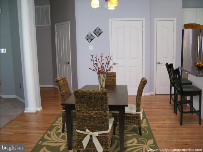 9319 Old Court Road Baltimore, MD 21244 - Photo 9 of 23 a view of a dining room with furniture and wooden floor
