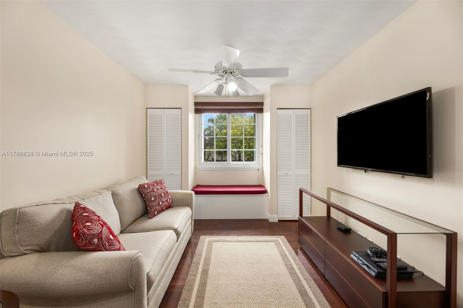 14612 Southwest 153rd Court Miami, FL 33196 - Photo 12 of 26 a living room with furniture and a flat screen tv