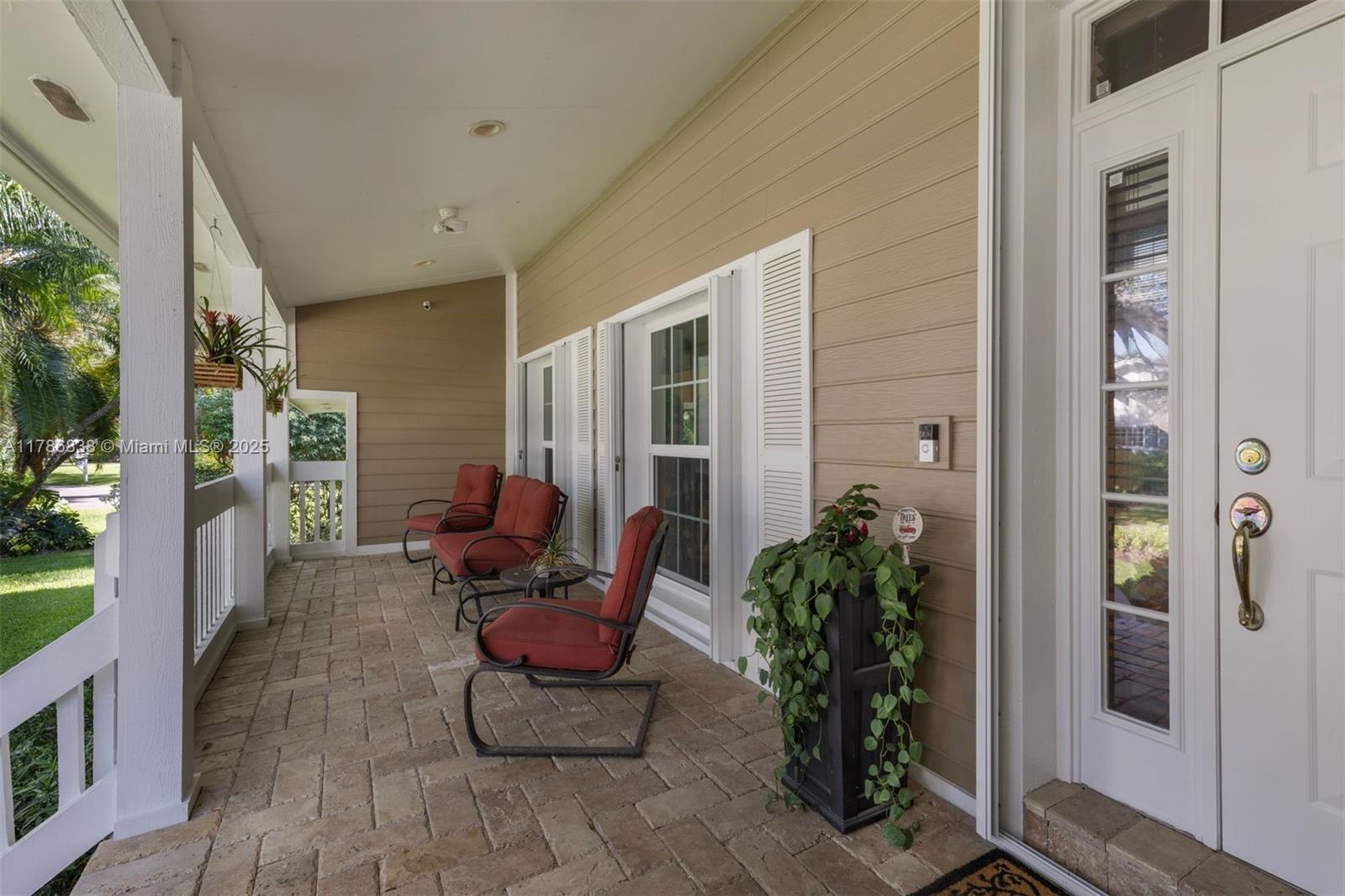 14612 Southwest 153rd Court Miami, FL 33196 - Photo 16 of 26 a balcony with furniture and a potted plant