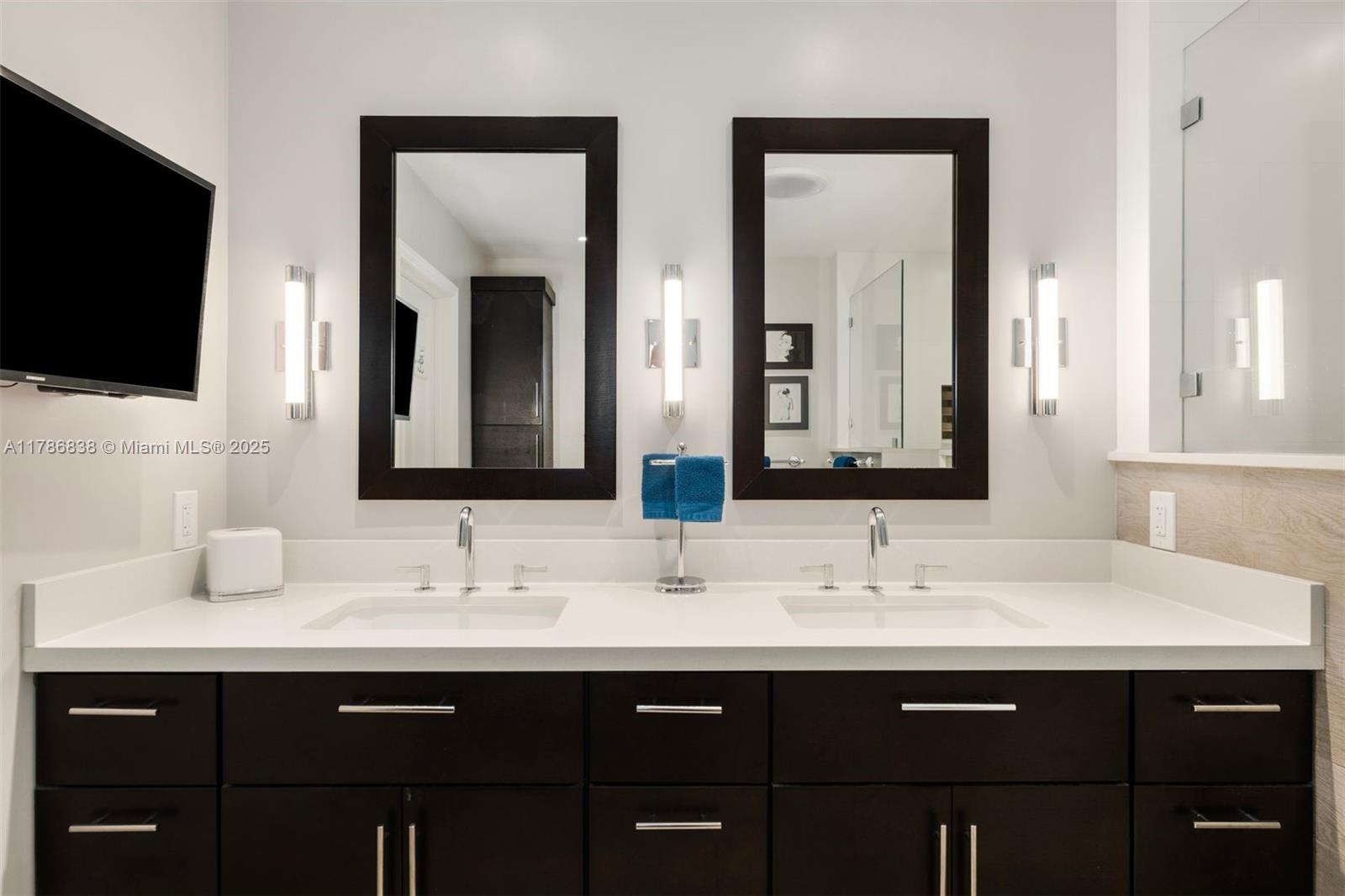 14612 Southwest 153rd Court Miami, FL 33196 - Photo 20 of 26 a bathroom with double sink and a mirror