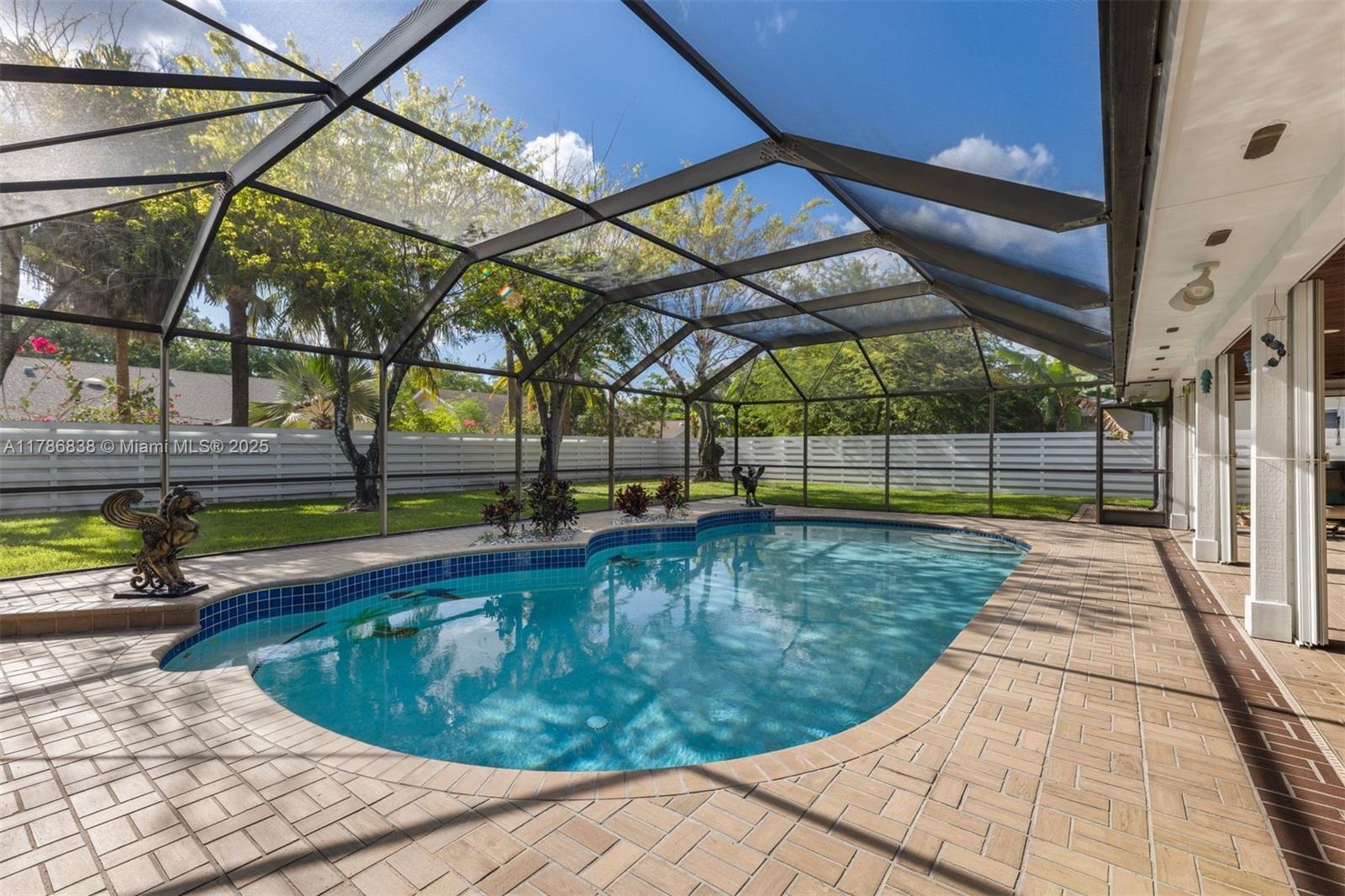 14612 Southwest 153rd Court Miami, FL 33196 - Photo 22 of 26 a view of a swimming pool with a patio