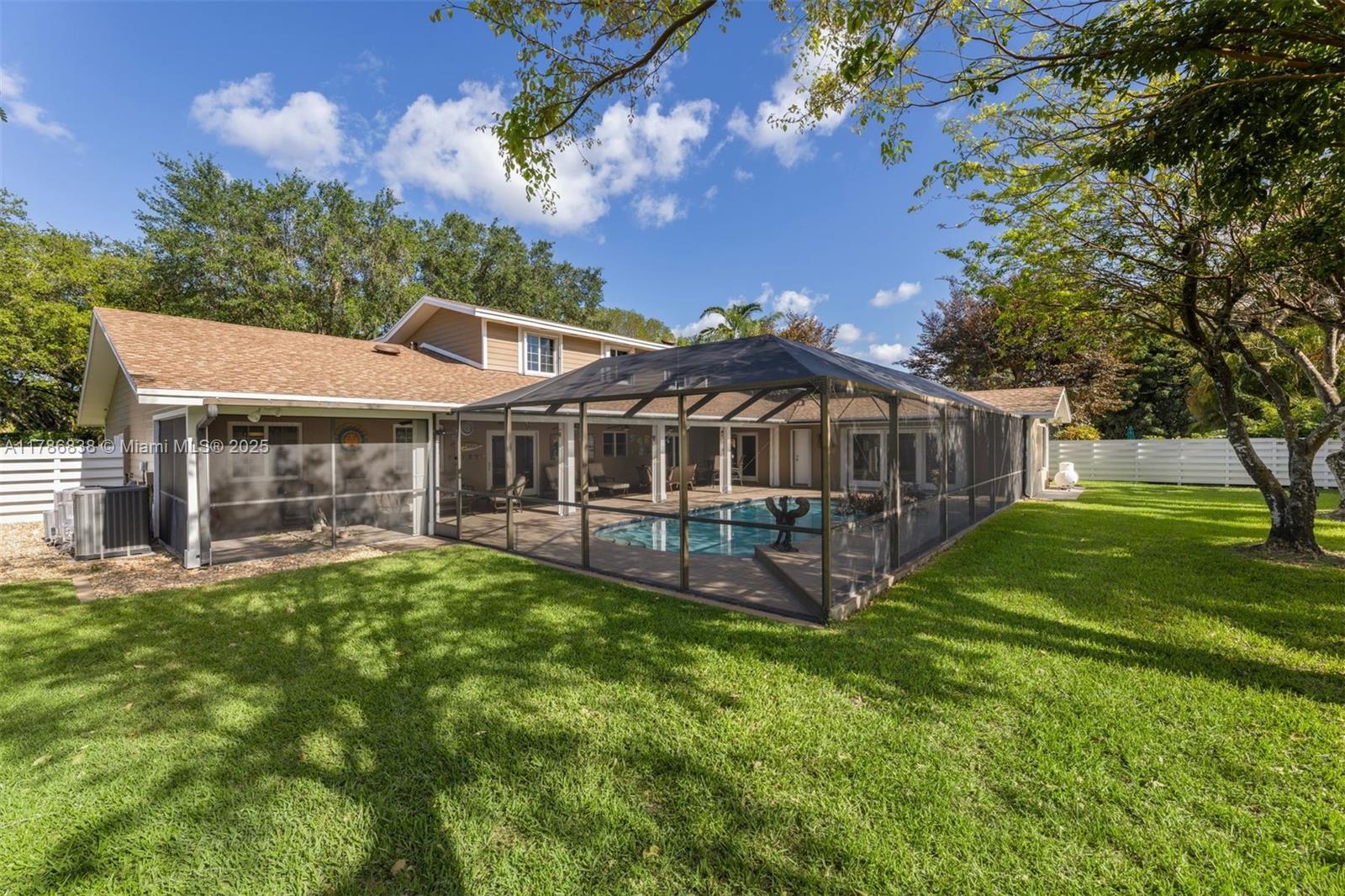 14612 Southwest 153rd Court Miami, FL 33196 - Photo 23 of 26 a view of a house with a yard