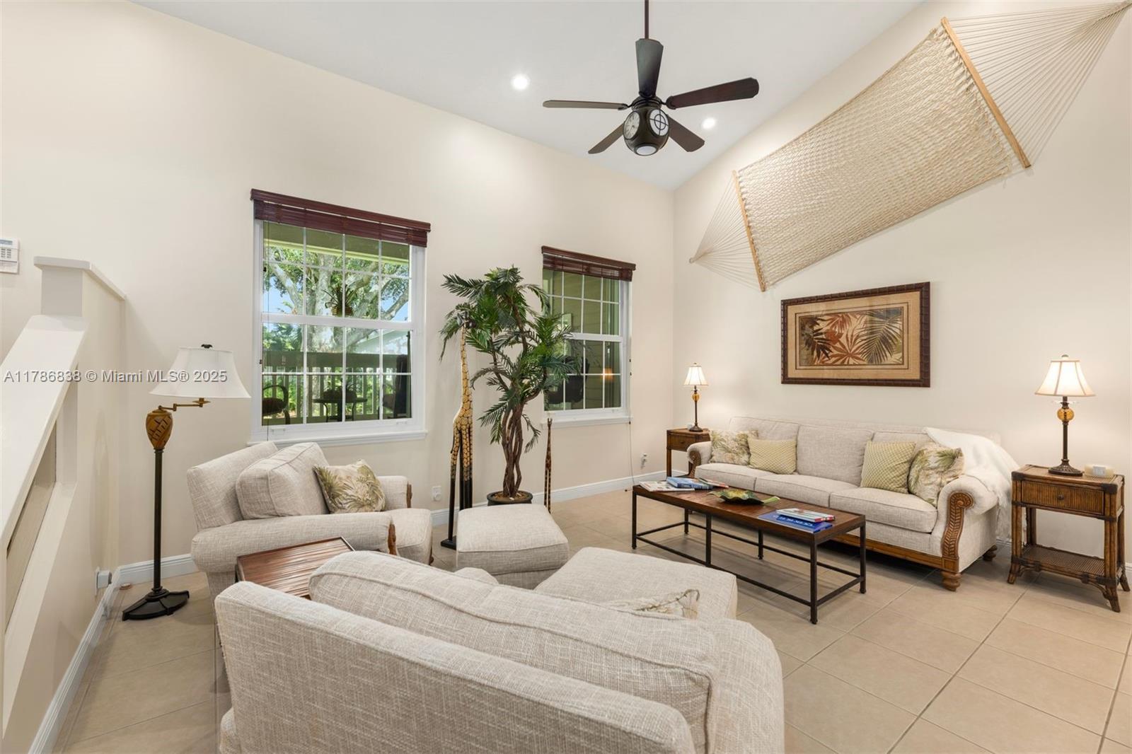 14612 Southwest 153rd Court Miami, FL 33196 - Photo 3 of 26 a living room with furniture and a large window