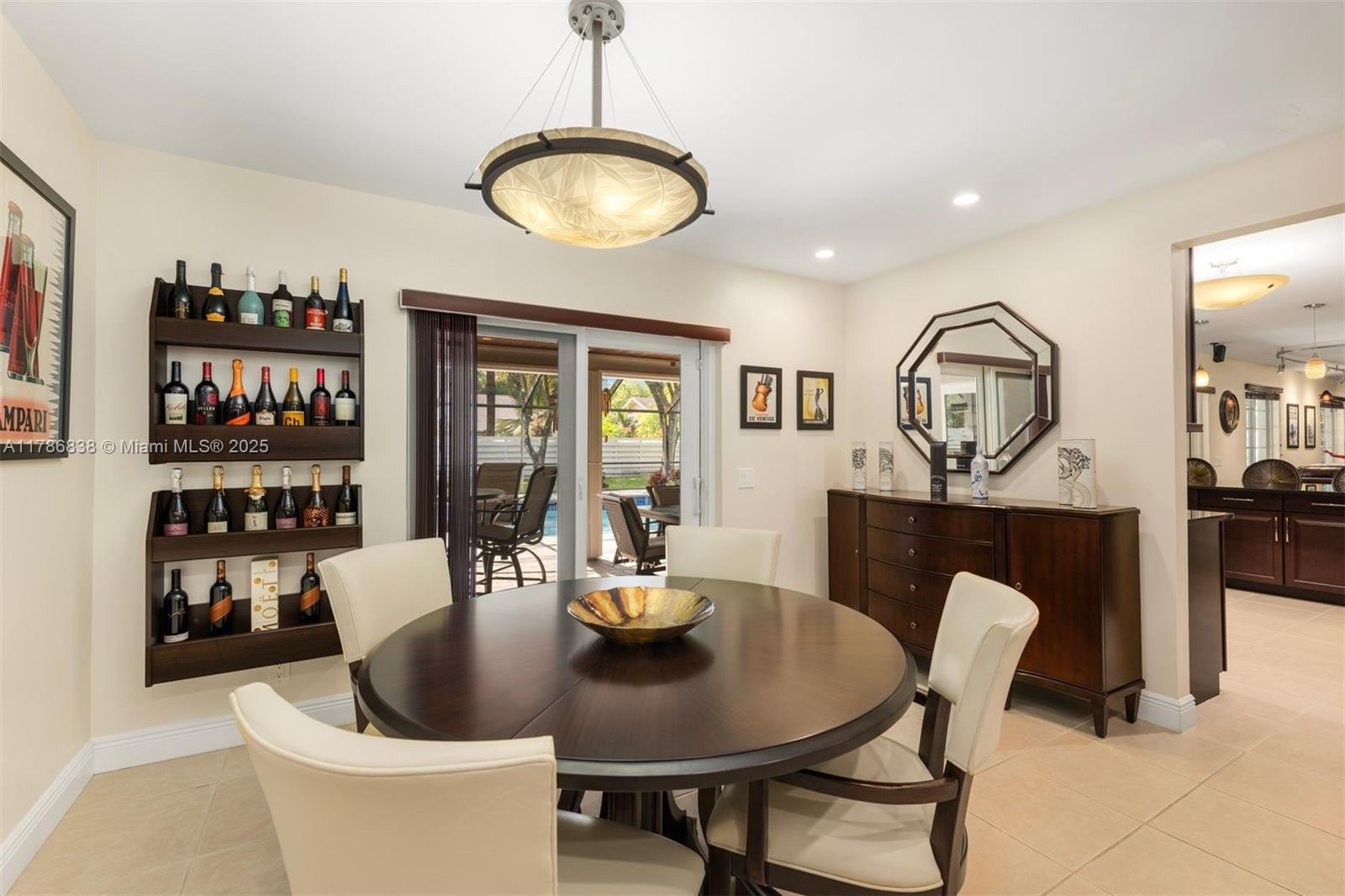 14612 Southwest 153rd Court Miami, FL 33196 - Photo 4 of 26 a view of a dining room with furniture a rug and wooden floor