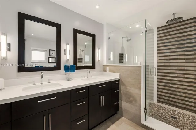 a bathroom with a double vanity sink and a mirror