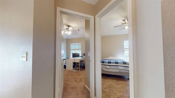 a view of a bedroom from a hallway