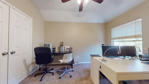 a workspace with furniture and a window