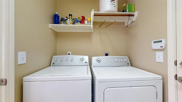 a utility room with dryer and washer