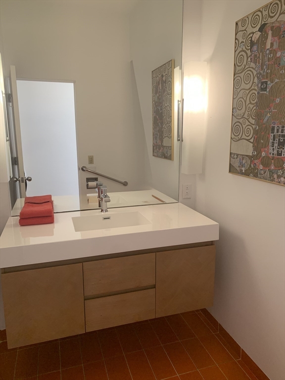 17 Deer Run Wayland, MA 01778 - Photo 10 of 42 a bathroom with a sink and a mirror