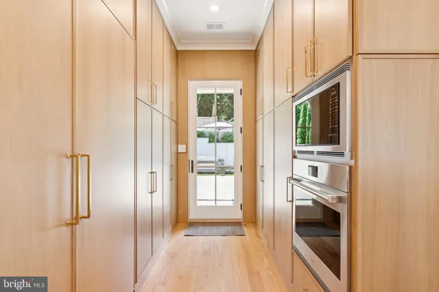 a living room with furniture fireplace and a large window