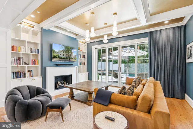 a bathroom with a sink a mirror a toilet and a window