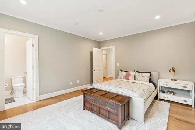 a view of entryway with wooden floor and windows