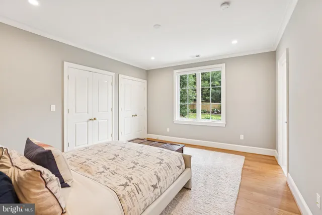 a bedroom with a large bed and furniture