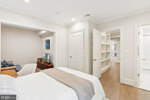 a view of a patio with a table and chairs under an umbrella