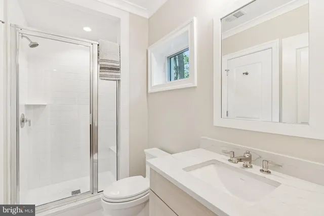 a view of a patio with chairs and umbrellas