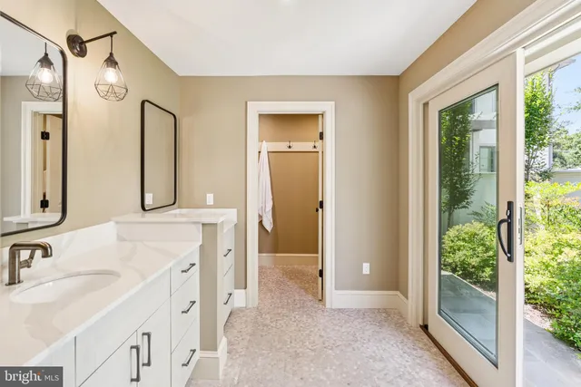 a front view of a house with trees