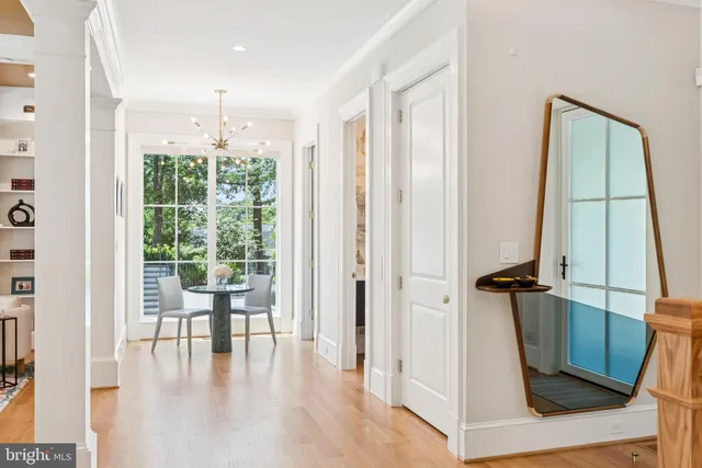 a view of front door with chair and glass door