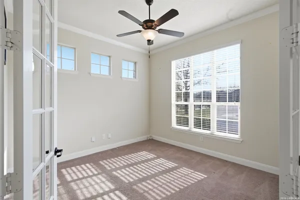 a view of an empty room with a window