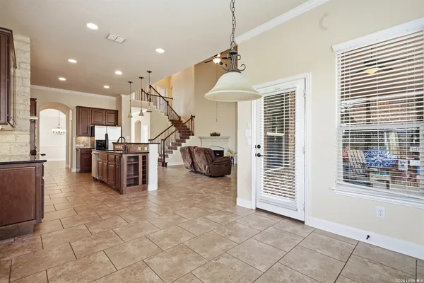 a view of a kitchen with furniture and a window