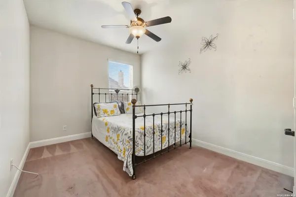 a view of an empty room with a fan