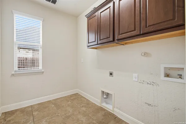 a view of cabinets and window