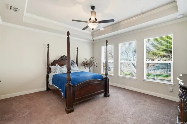 a bed sitting in a room next to a window