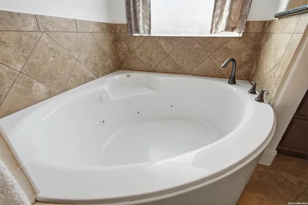 a white bath tub sitting in a bathroom