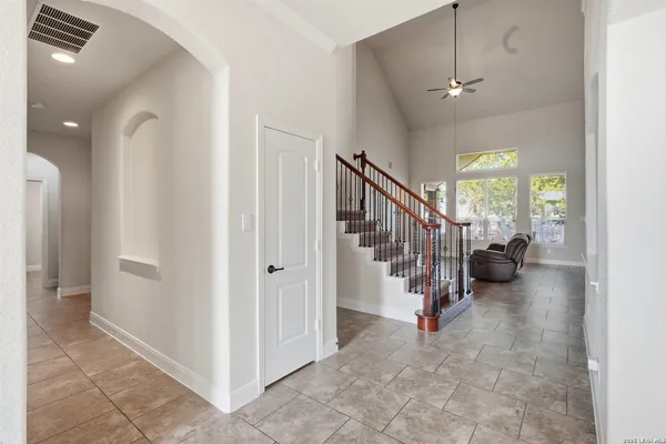 a view of a livingroom with furniture and stairs