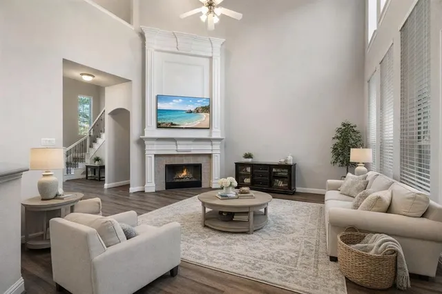 a living room with furniture and a fireplace