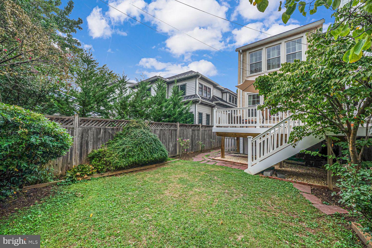 3614 Ordway Street Northwest Washington, DC 20016 - Photo 20 of 81 a view of a house with a yard and plants