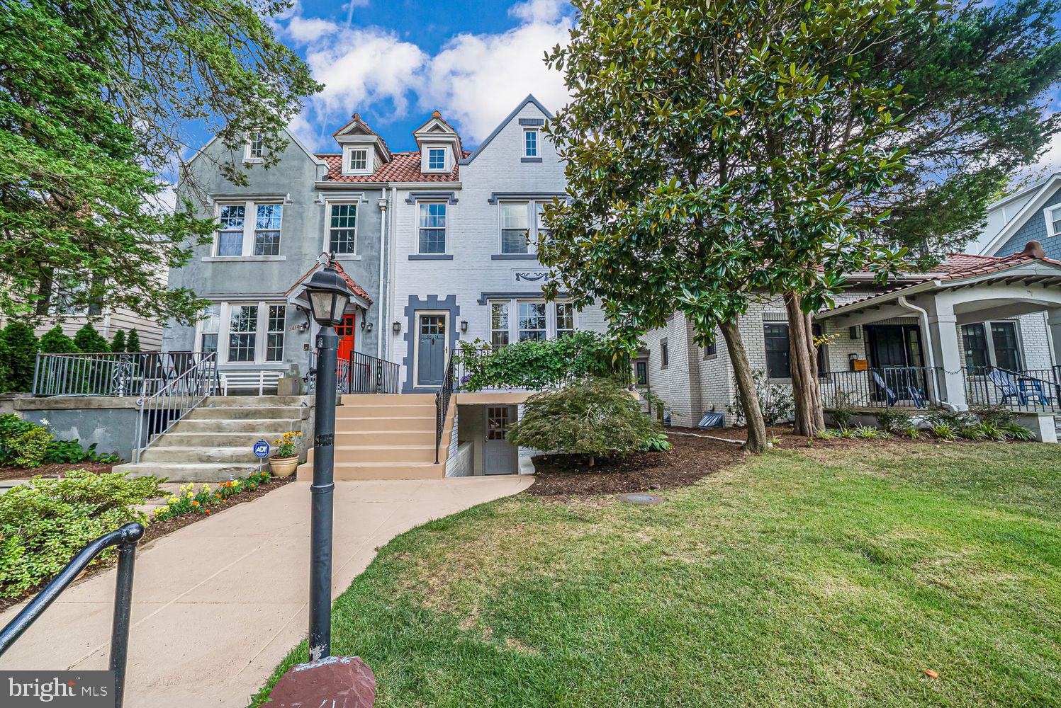 3614 Ordway Street Northwest Washington, DC 20016 - Photo 2 of 81 a front view of a house with a yard and porch