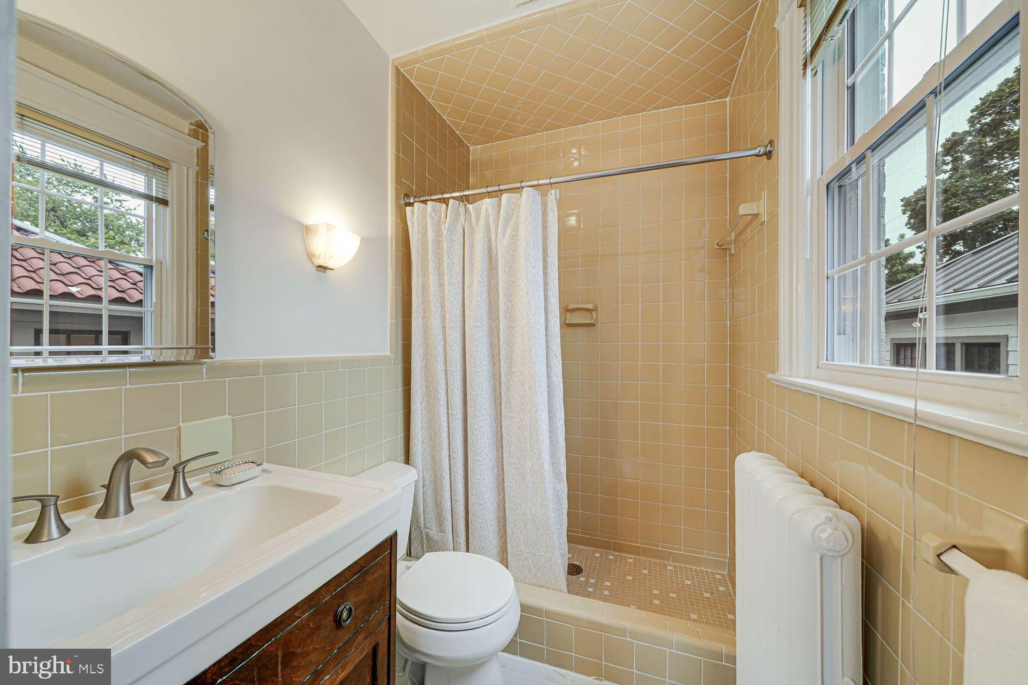 3614 Ordway Street Northwest Washington, DC 20016 - Photo 25 of 81 a bathroom with a sink toilet and shower