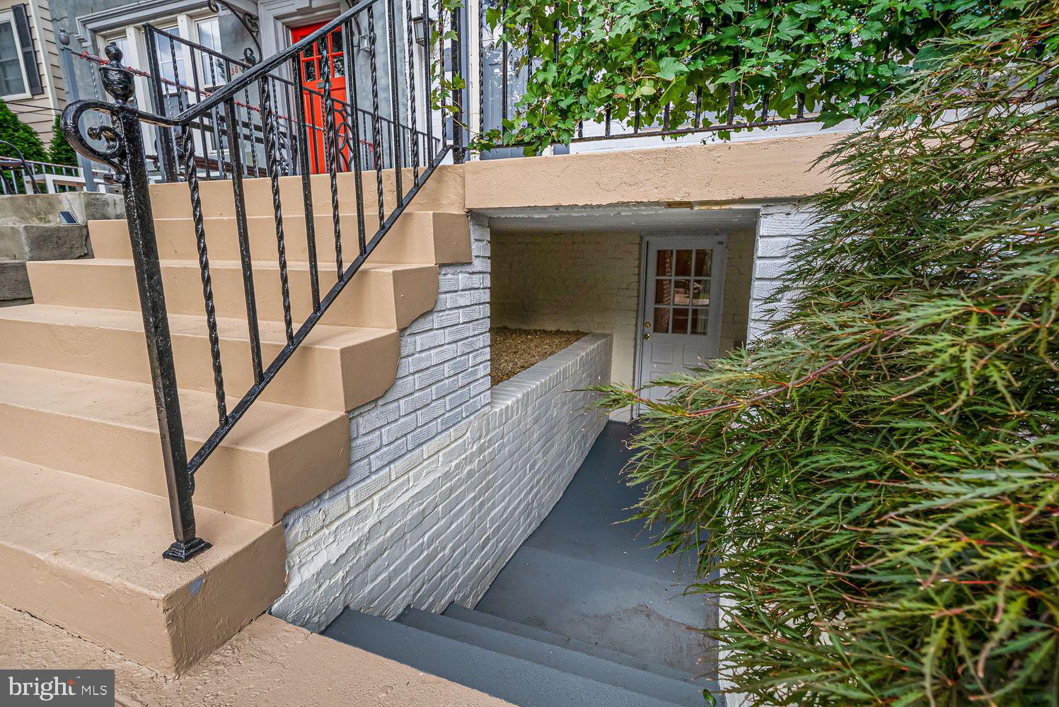 3614 Ordway Street Northwest Washington, DC 20016 - Photo 48 of 81 a view of house with wooden stairs and potted plants