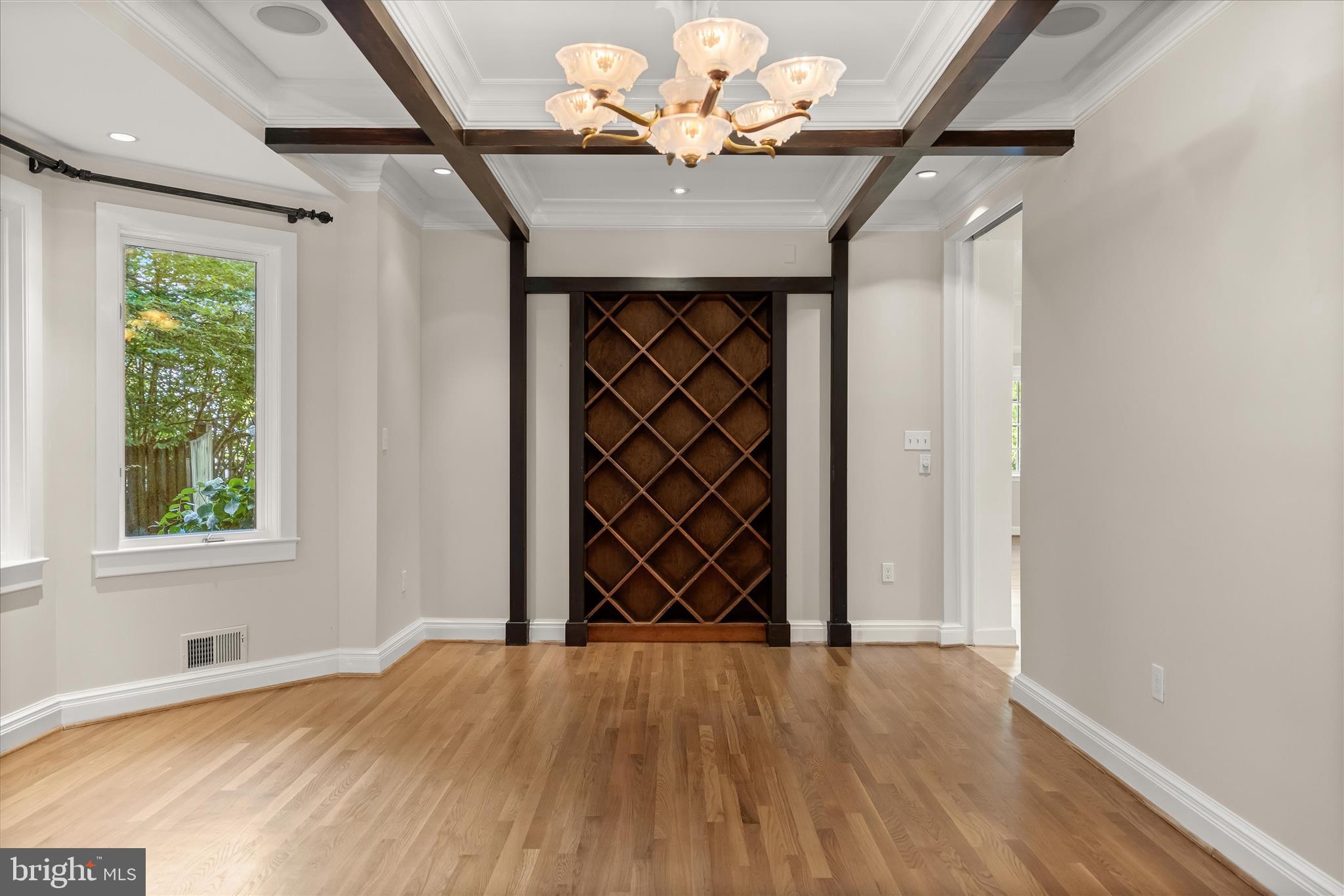 5104 Scarsdale Road Bethesda, MD 20816 - Photo 23 of 68 a view of empty room with wooden floor and fan