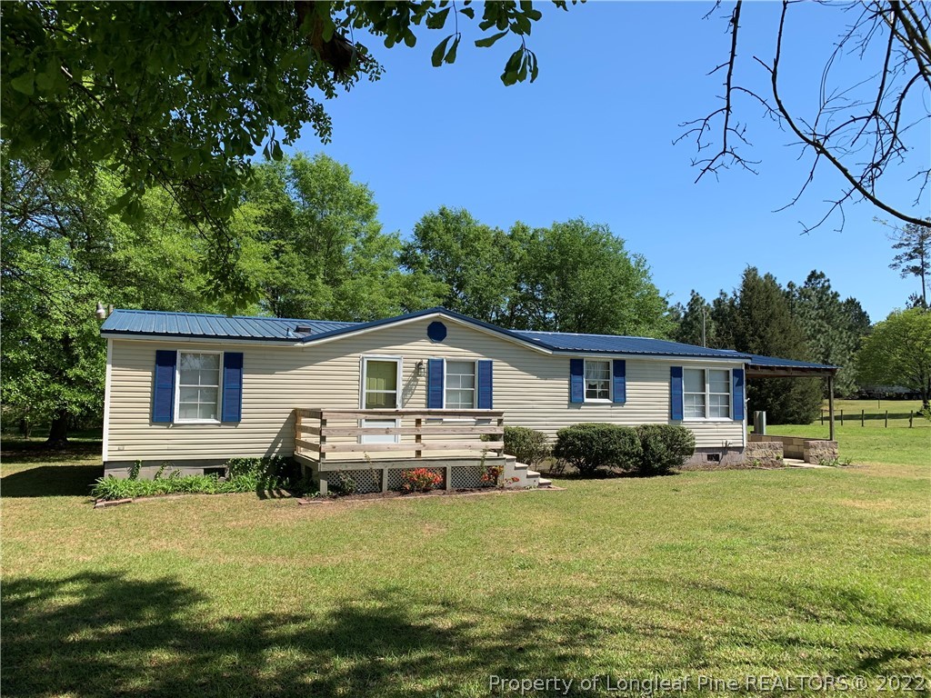 228 L A Sandy Road Raeford, NC 28376 - Photo 1 of 36 a front view of house with yard and green space