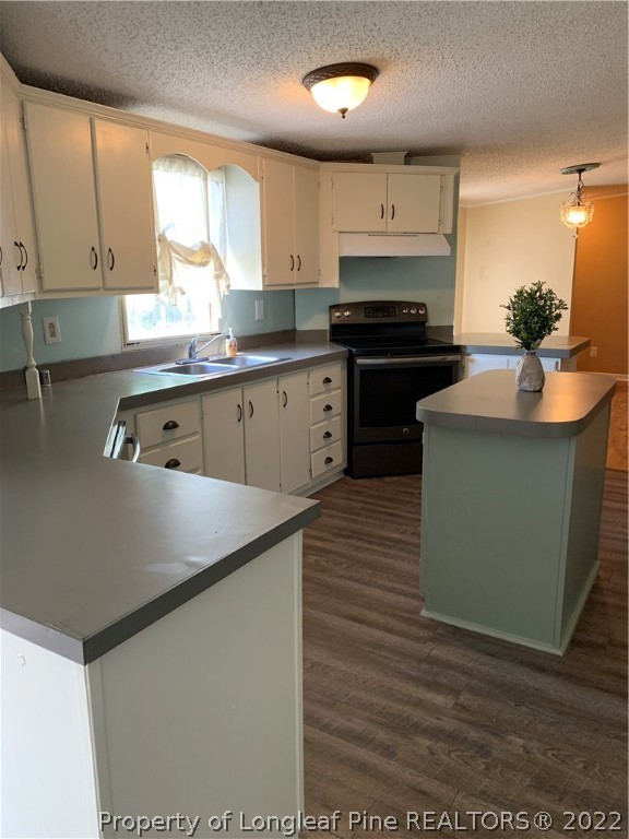 228 L A Sandy Road Raeford, NC 28376 - Photo 14 of 36 a kitchen with stainless steel appliances granite countertop a stove a sink and a microwave