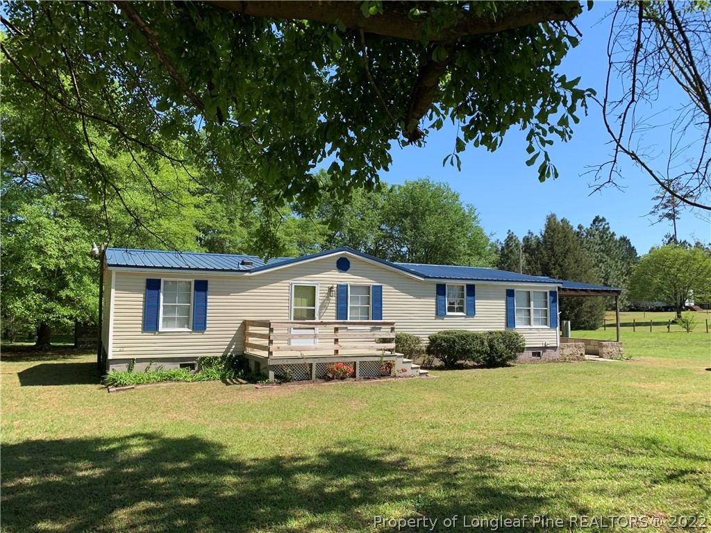 228 L A Sandy Road Raeford, NC 28376 - Photo 2 of 36 a front view of house with yard and green space